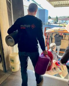 Multiply Europe worker assisting with the daily tasks